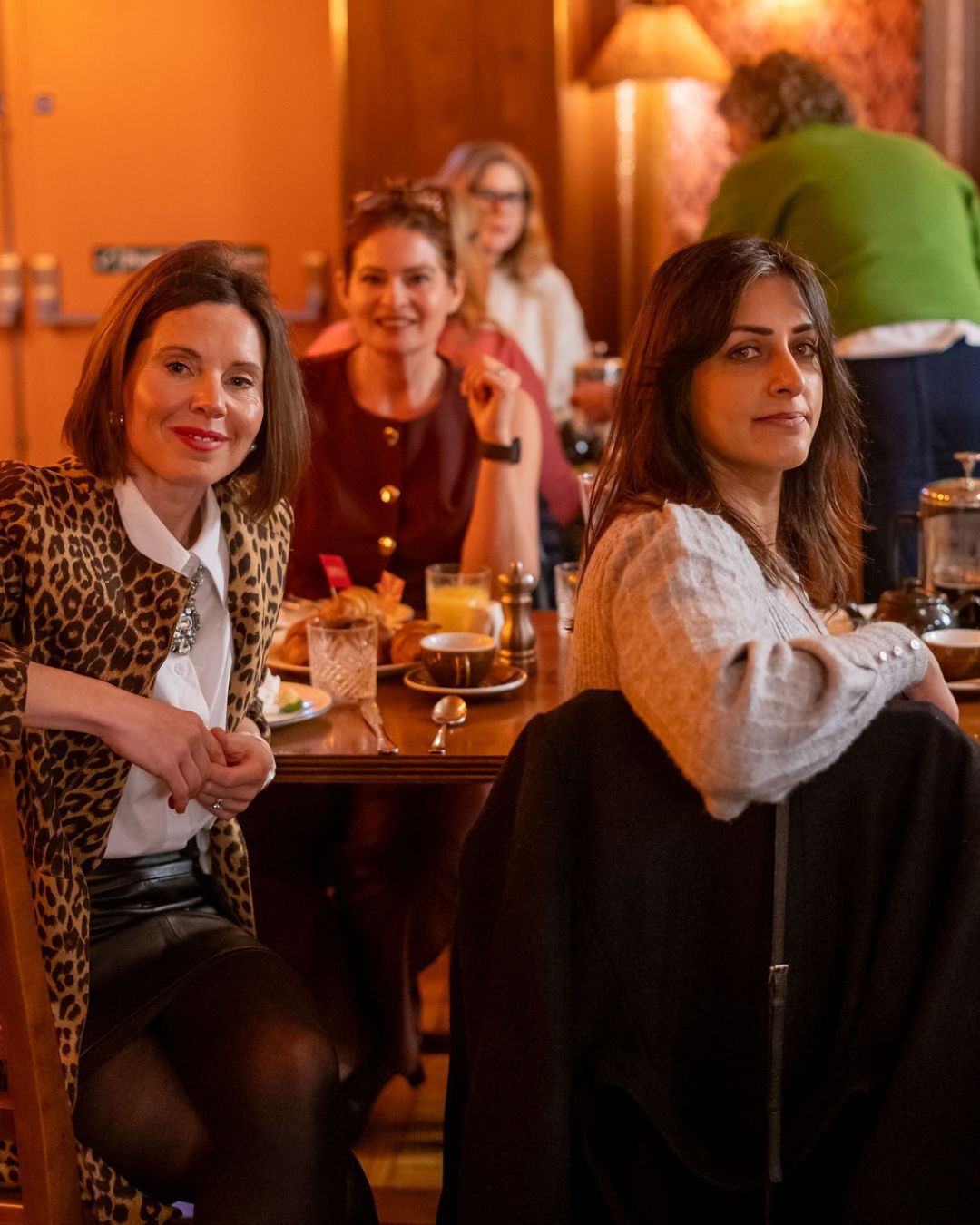 Guests seated around a table at Cosy Club