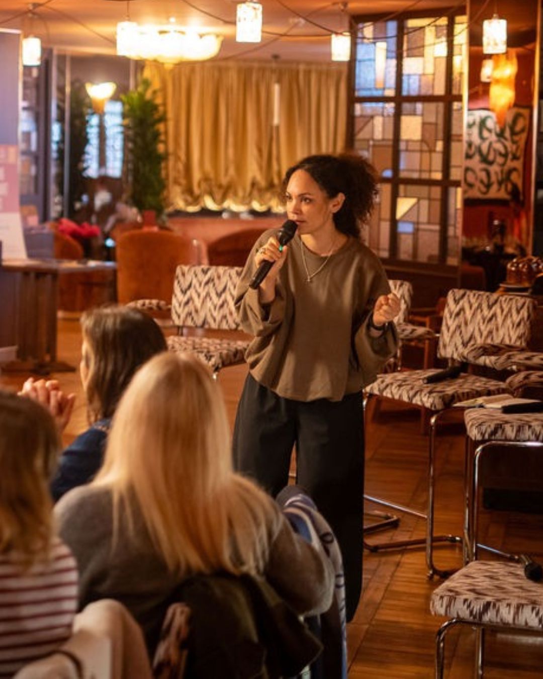 Comedy set: a performer with a microphone in front of the audience