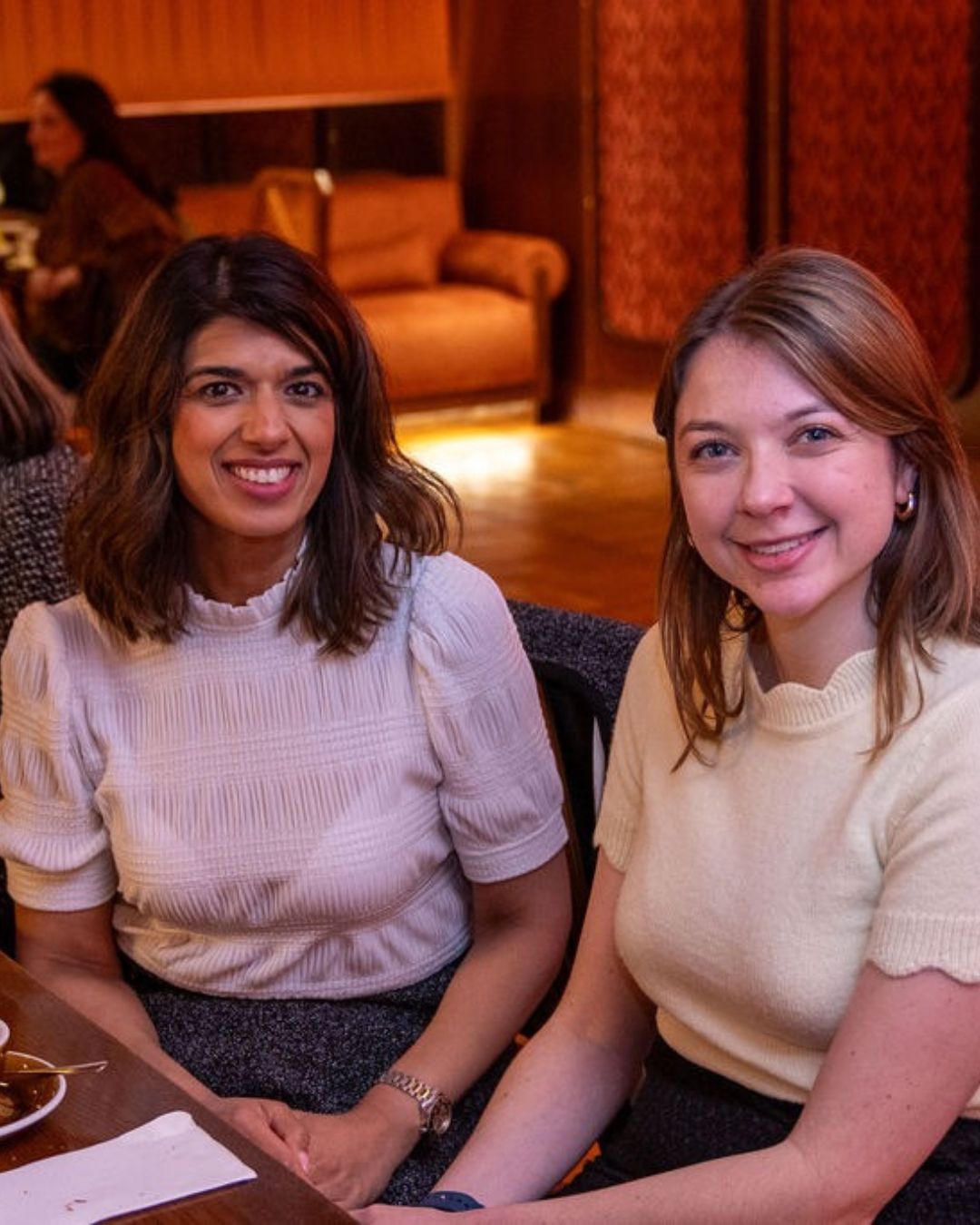 Two guests sitting together at the breakfast